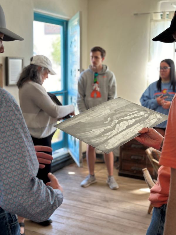 Students at Doel Reed's studio with printmaking plate
