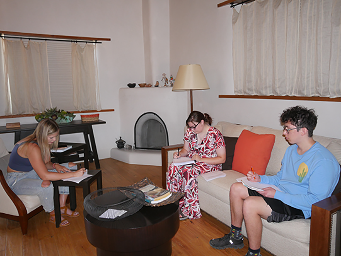 three students studying inside at the Doel Reed Center