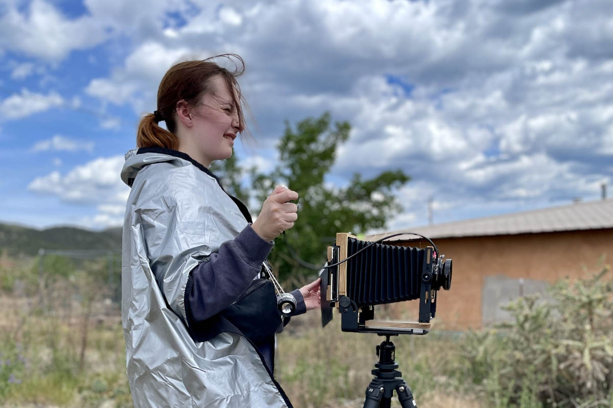 Student with large format camera